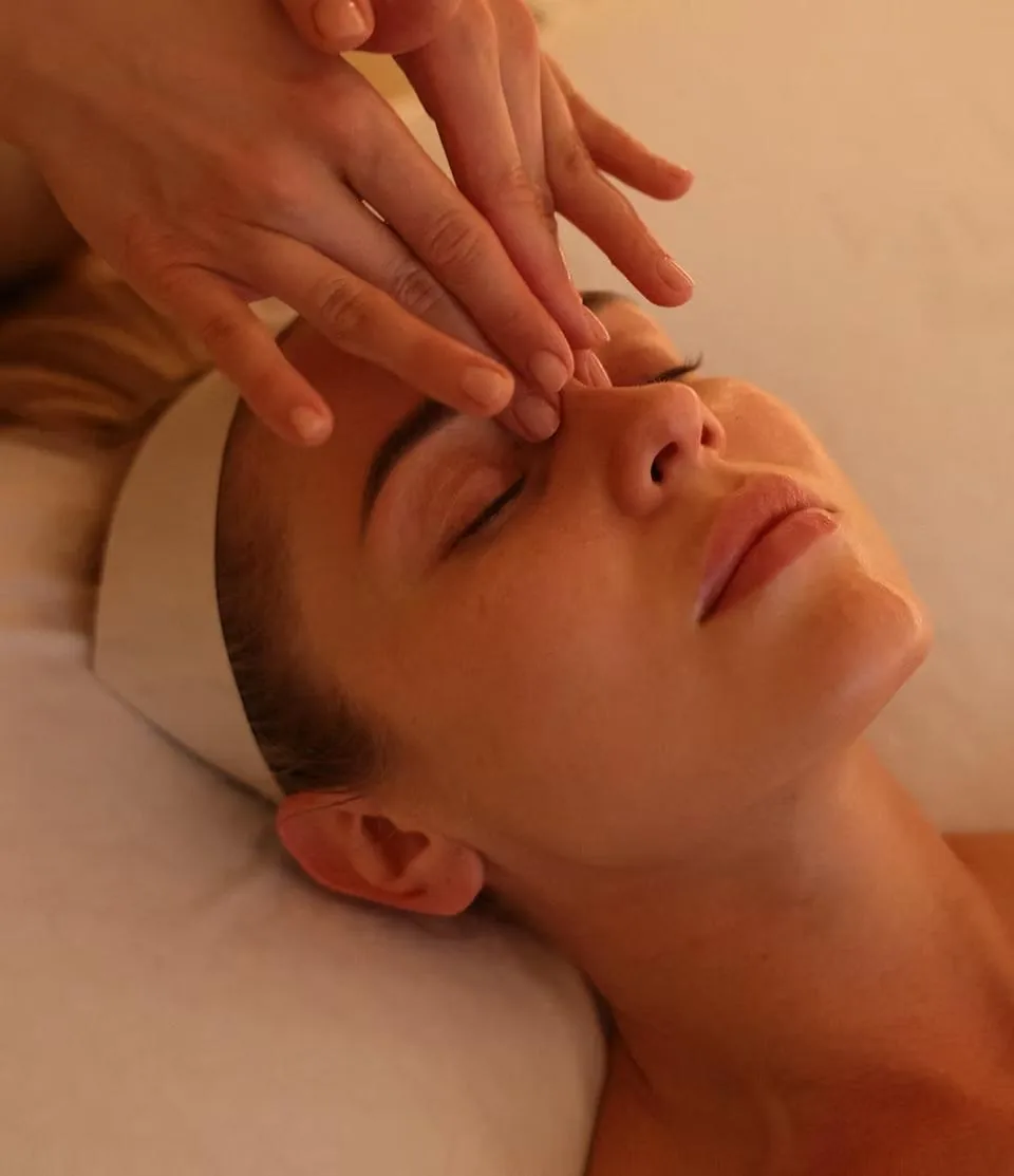 Client receiving a gentle face massage at LIMFAERA