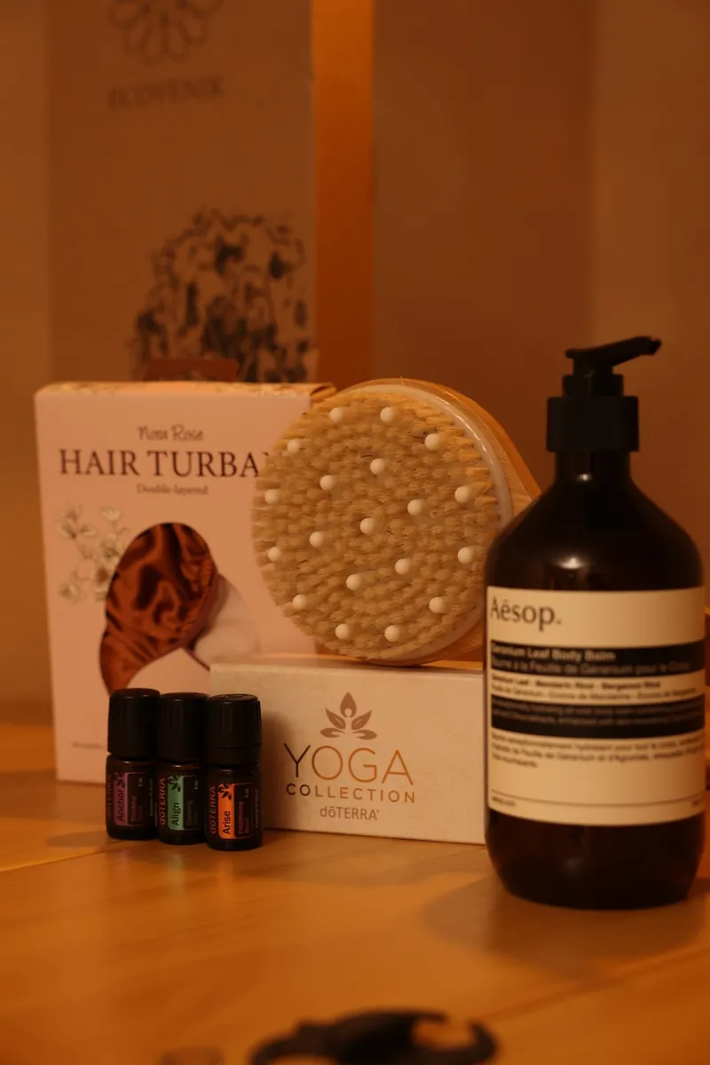 Body care products and a massage brush at the studio